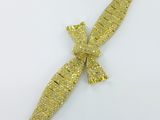 une broche en forme de poignard, en or et diamants