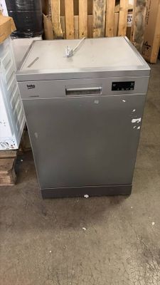 an image of a silver dishwasher sitting in a warehouse