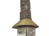 a very old looking knife with a very long blade