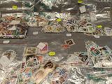 a lot of stamps on the table with stickers on them