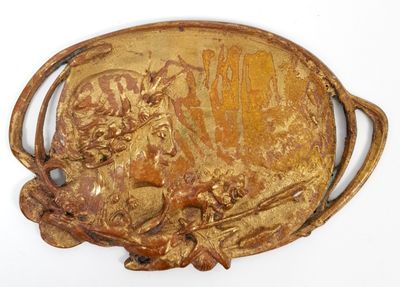 a gold belt buckle with a picture of a bull on it