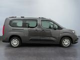 the grey van is parked on the concrete floor in the room