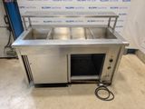 an image of a stainless steel kitchen with a sink and a hose
