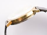 an image of a close up of a watch on a white surface