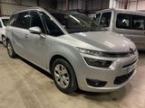 the silver citrole is parked next to other cars in a garage