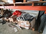a pile of wires and other items in a warehouse