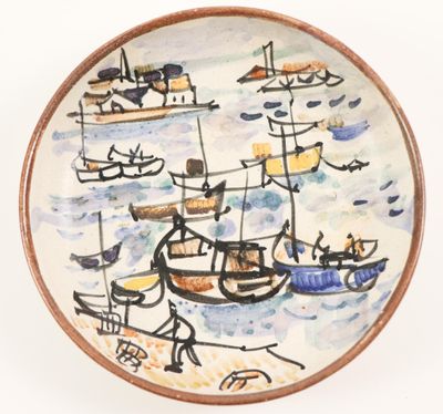 a plate with a painting of boats on it