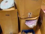 many boxes of stuff sitting on the floor in the store