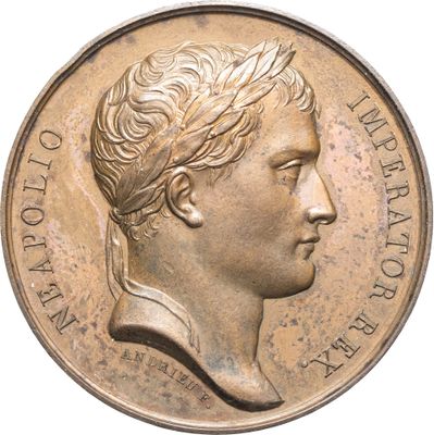 gros plan d'une pièce de monnaie sur laquelle figure un visage de femme