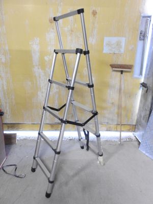 a ladder that is leaning against a wall in a room