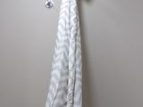a towel hanging on a hook on the wall