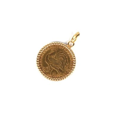 a close up of a gold coin on a white background