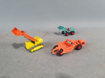 three toy trucks that are sitting next to each other