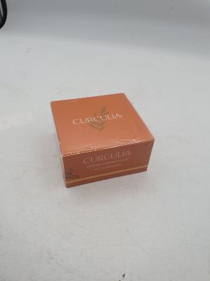 an orange box sitting on top of a white table next to a black chair