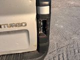 a close up of the rear end of a white truck