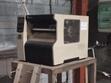 a machine that is sitting on a stand in a building