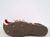 a close up of a pair of shoes on a white surface