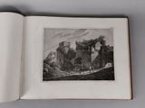 an open book with a picture of a castle in the middle of it