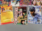 a lot of comic books that are on the table