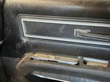 an old car door handle with a metal latch