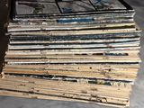 a stack of newspapers sitting on top of a table