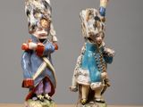 pair of figurines of a soldier and a soldier with a drum