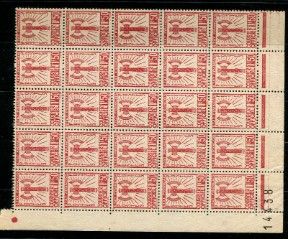 a red and white postage stamp on a black background