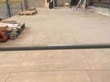 a large room with a lot of construction materials on the floor