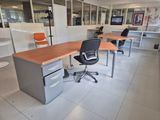 two desks and two chairs in this office
