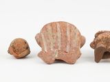 five small figurines of animals on a white surface