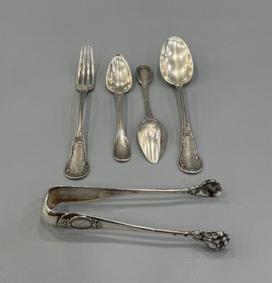 a lot of spoons and forks that are on the table