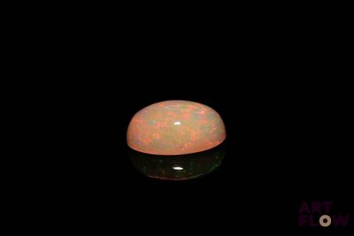 an image of a white oplite in the dark
