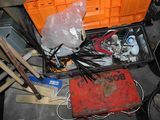 a tool box full of assorted items in a garage