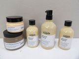 several different types of hair products are sitting on a table