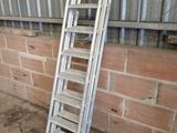a ladder leaning against a brick wall in a building