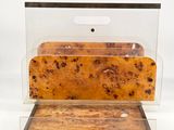 a piece of bread in a clear box on a white surface