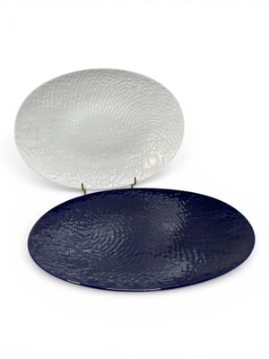 an image of a white and blue plate sitting on top of each other