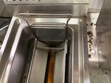 an image of a kitchen with a sink and a toaster