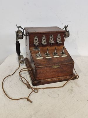 an old fashioned telephone that is sitting on a table
