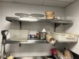 a kitchen with a lot of food on the shelves