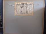 a picture of a refrigerator with a newspaper hanging on it
