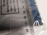 a ruler that is on top of a piece of plastic