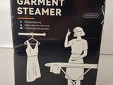 the box of the garment steamerer is sitting on the table