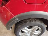 a close up of a tire on a red car