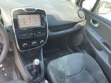 a dashboard of a small car with a steering control