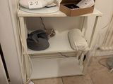 a white shelf with a lamp and a box on it