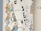 an open book with a map of the city