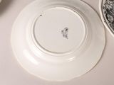 a white plate with a black and white design on it