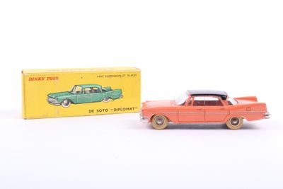 an image of a toy car next to a box of toys
