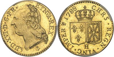 une pièce souveraine en or surmontée d'une couronne